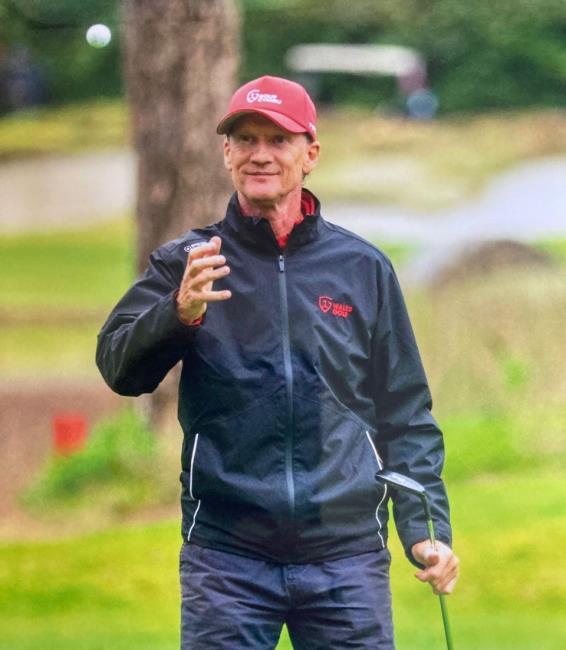 Alan Jones playing golf